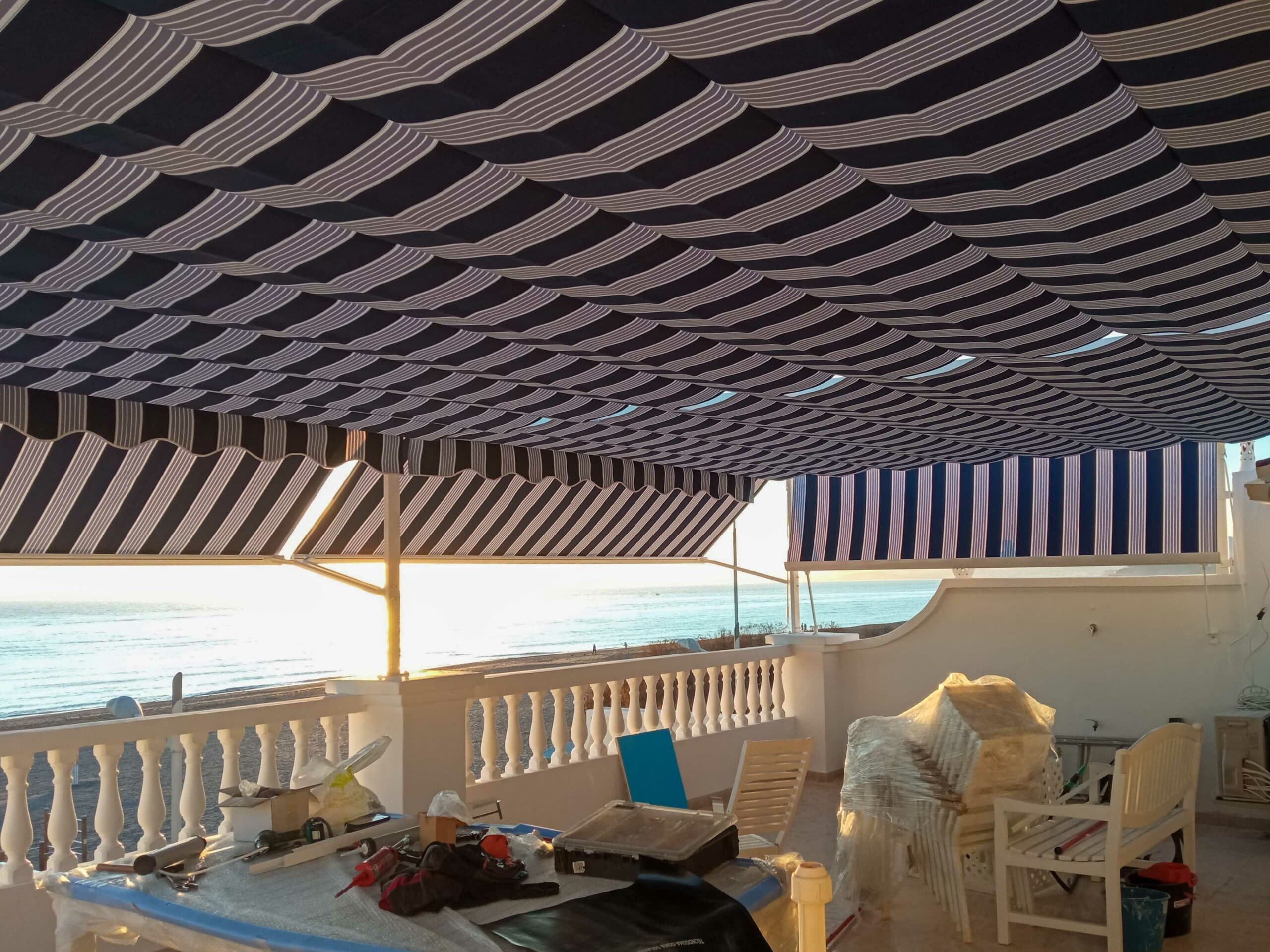 Sistema de toldo para proteger del sol